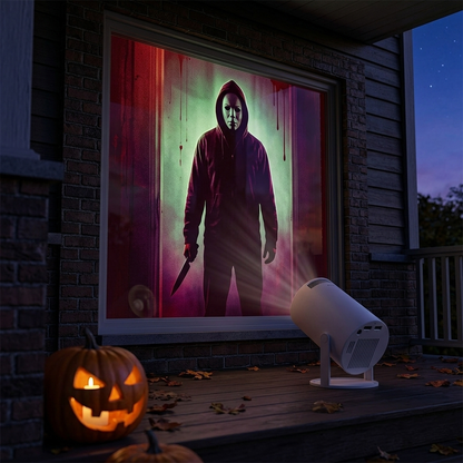 EmberVue Halloween Projector casting a spooky masked figure scene onto a window at dusk
